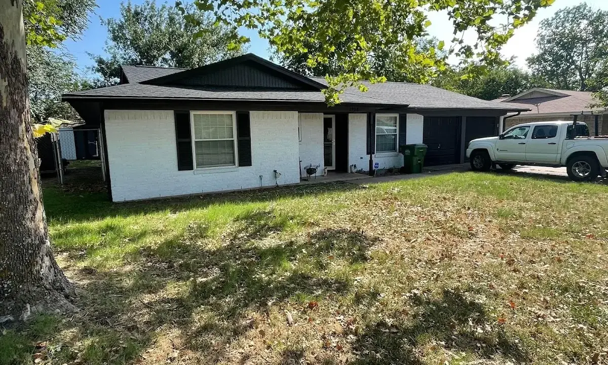 Professional roofing crew working on a residential roof in Toccoa